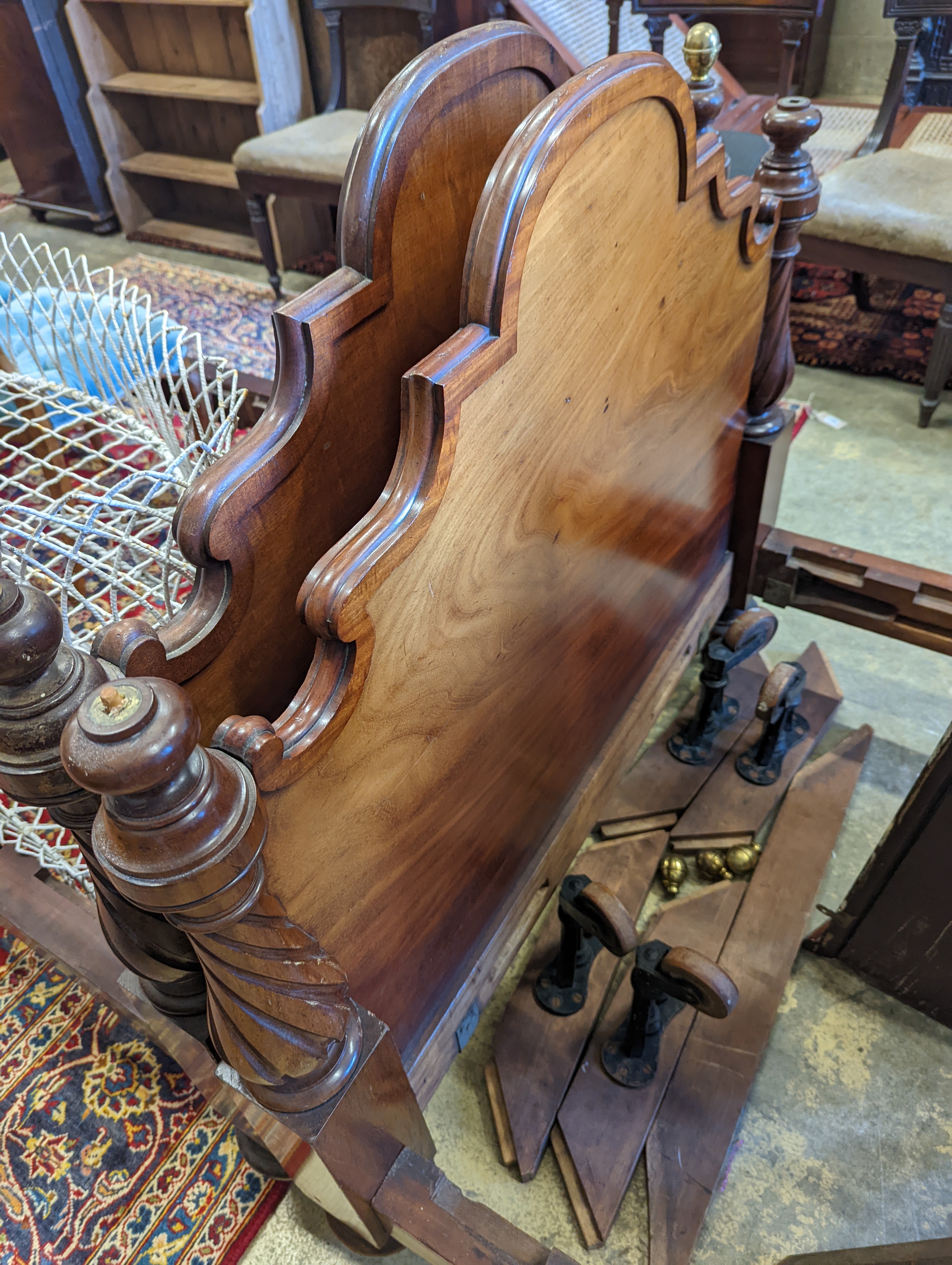 A pair of Victorian mahogany single bed frames, length 210cm, width 107cm